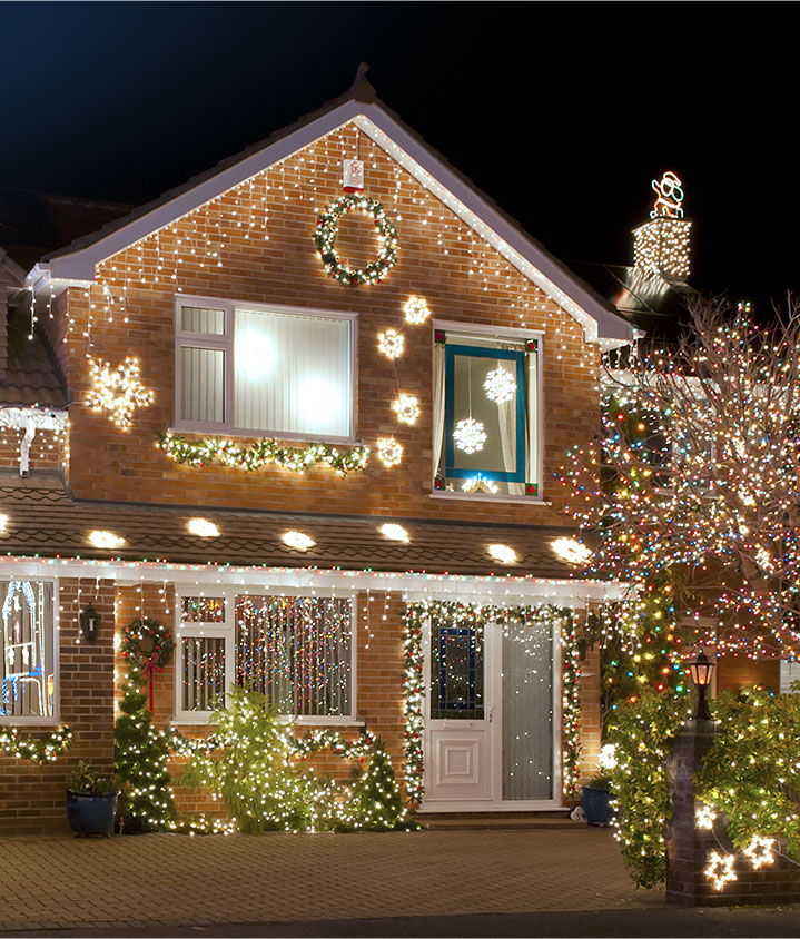 house with Christmas light installation